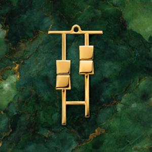 Gold Fader Necklace on green marble