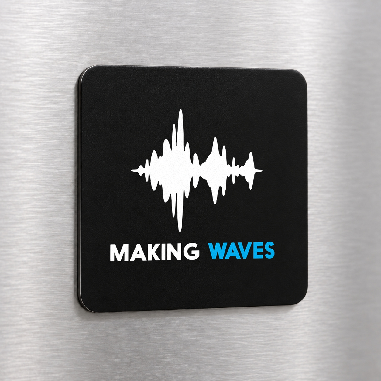 Making Waves fridge magnet on a silver refrigerator