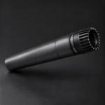 Graphite microphone-shaped flashlight with dark slotted head and Melodynamic Studios branding