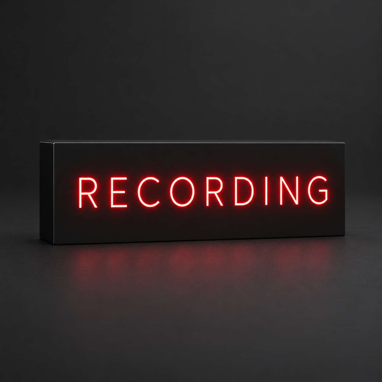 Black resin RECORDING sign with red illuminated lettering